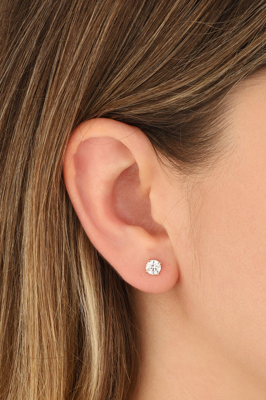 Single stone nailed silver earrings